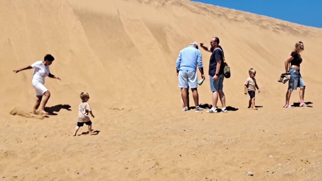 Family enjoying the Namibian sand dunes